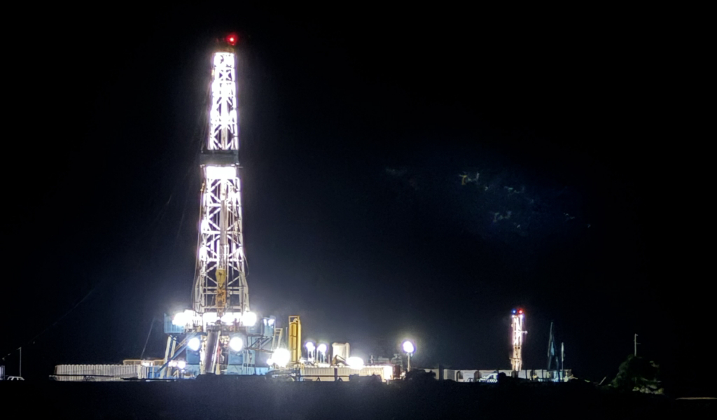 Oil drilling site at night